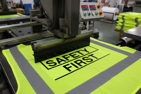 Safety vest being printed on. Dont show the person printing